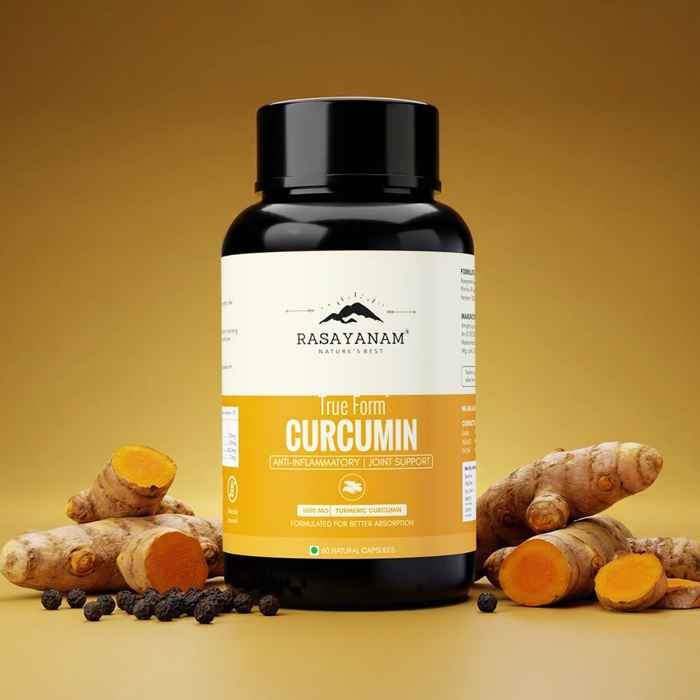 Bottle of Rasayanam True Form Curcumin with turmeric roots on a yellow background