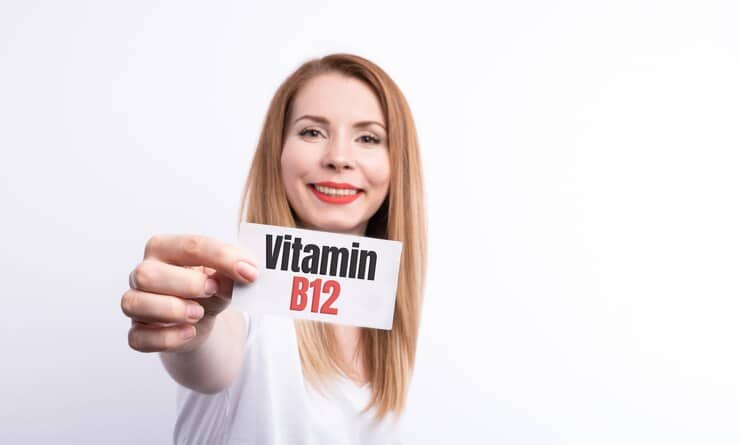 women hold a card vitamin B12 