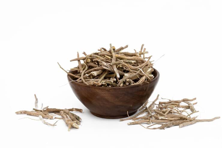 Ashwagandha root with wooden bowl